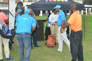 Golfers getting ready to tee off at hole 1, the Van Schaik Bookstores tent (2016 Durban Golf Challenge)